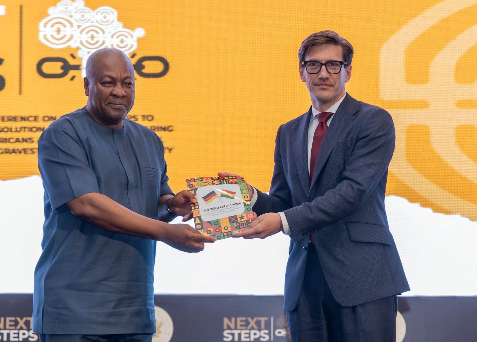 president john mahama receiving the catalogue